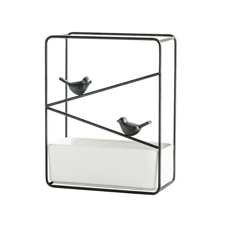 a black and white shelf with two birds on it