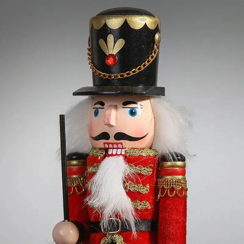 a nutcracker with a top hat and a cane