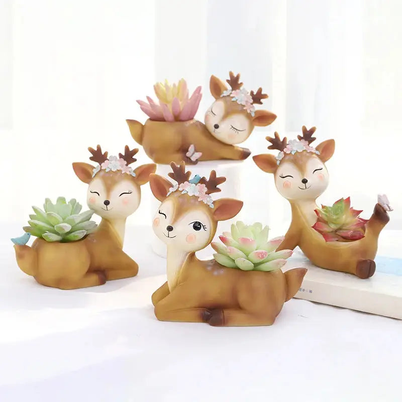 a group of deer figurines sitting on top of a table