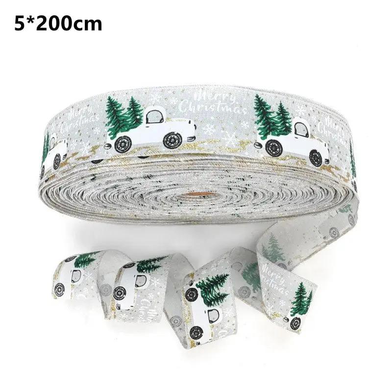 a roll of christmas ribbon with trees on it