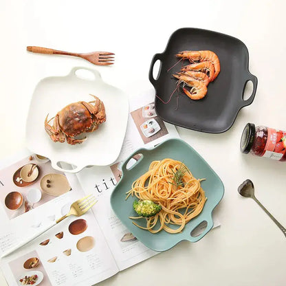 a table topped with plates of food and utensils