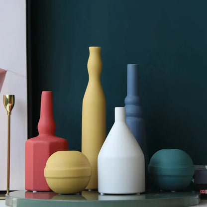 a group of vases sitting on top of a table