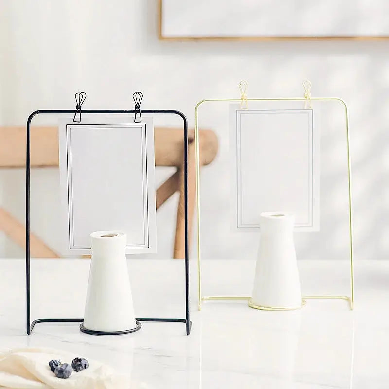 two white vases sitting next to each other on a table