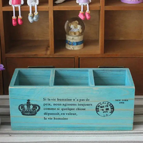 a wooden box sitting on top of a window sill