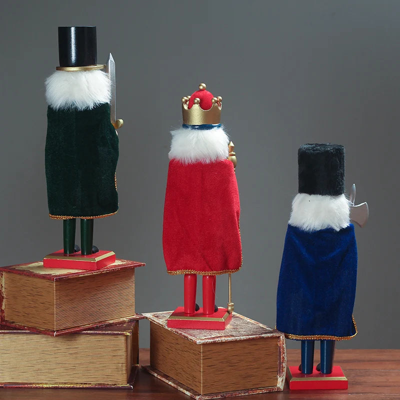 a group of three nutcrackers sitting on top of books
