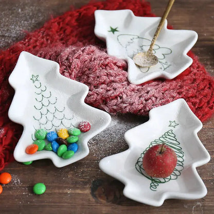 a couple of white dishes sitting on top of a wooden table