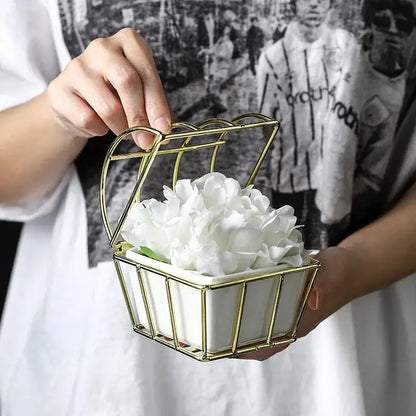 a person holding a basket with flowers in it