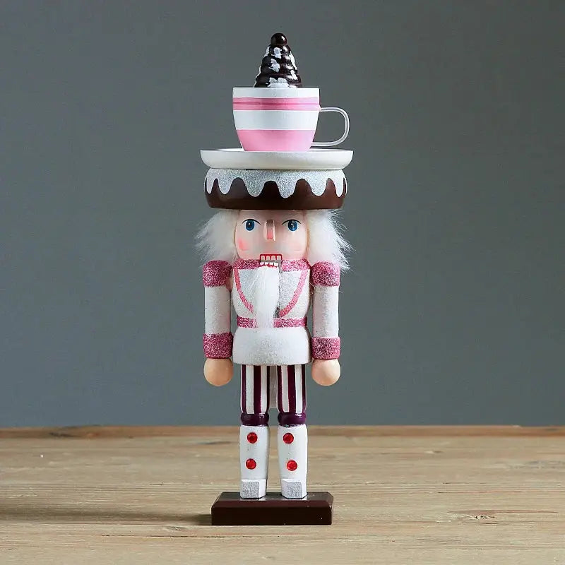 a nutcracker with a cup on top of it