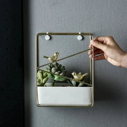 a person holding a plant in a glass container