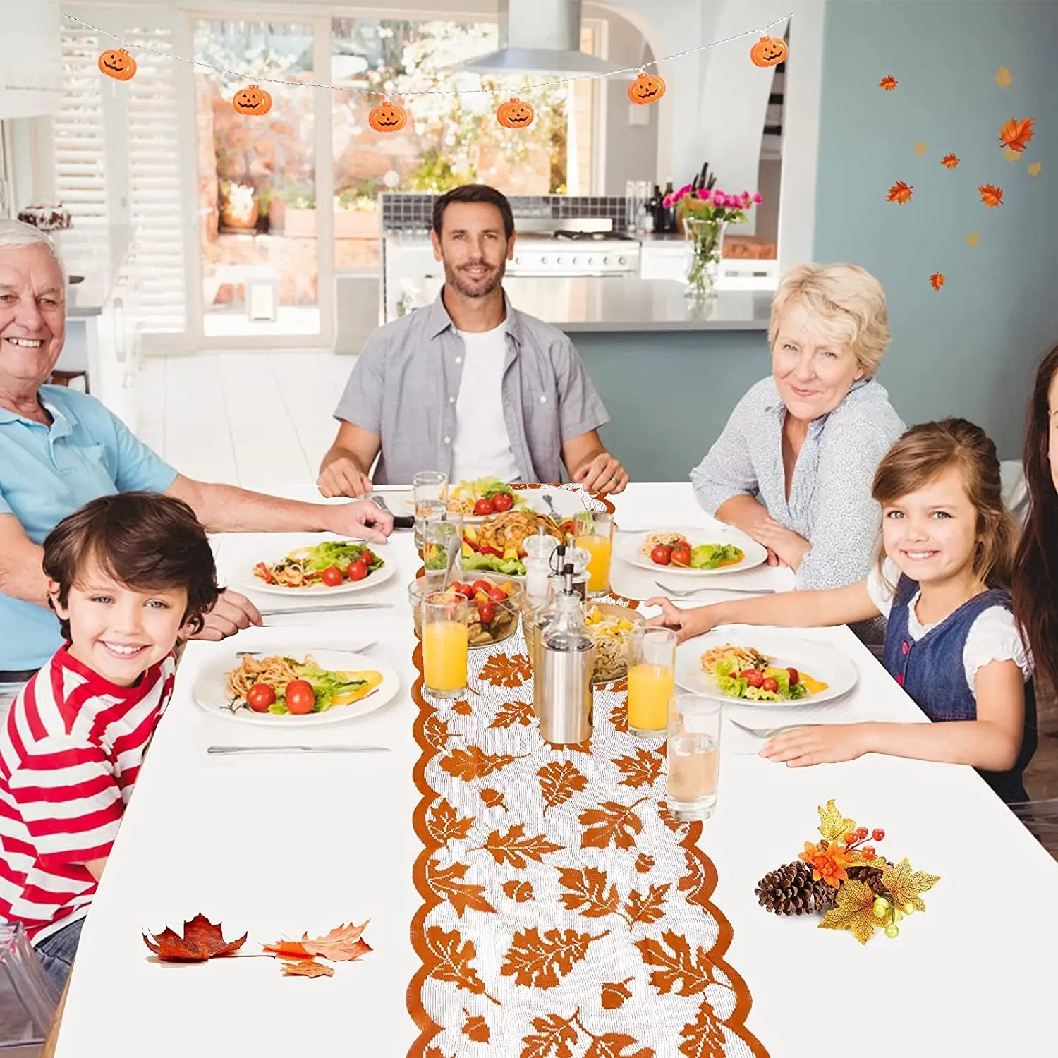 a group of people sitting at a table with plates of food