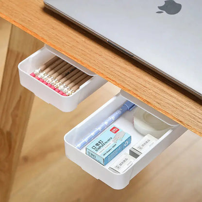 a laptop computer sitting on top of a wooden desk