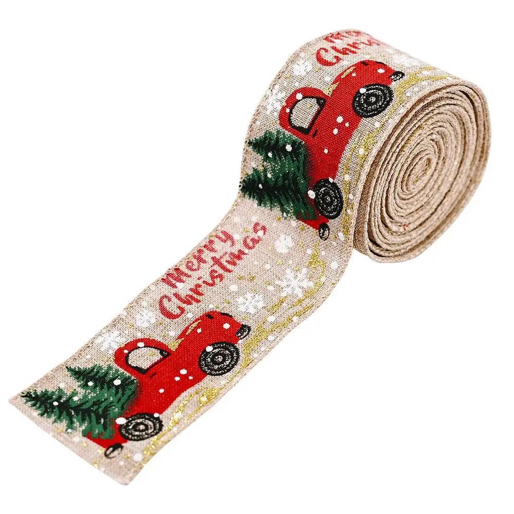 a christmas ribbon with a red car and trees on it