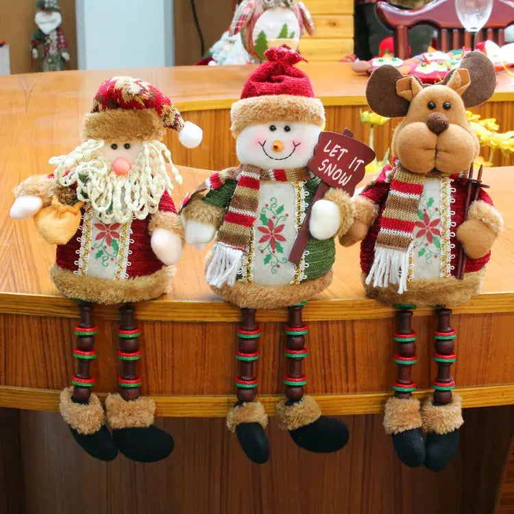 a group of stuffed animals sitting on top of a wooden table