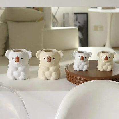 a group of small white bears sitting on top of a table