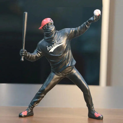 a statue of a baseball player holding a bat