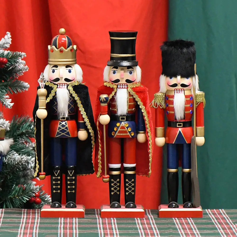 a group of nutcrackers standing next to a christmas tree