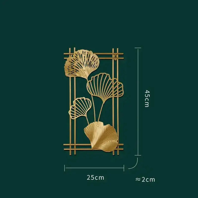 a gold metal wall decoration with three scallops on a green background