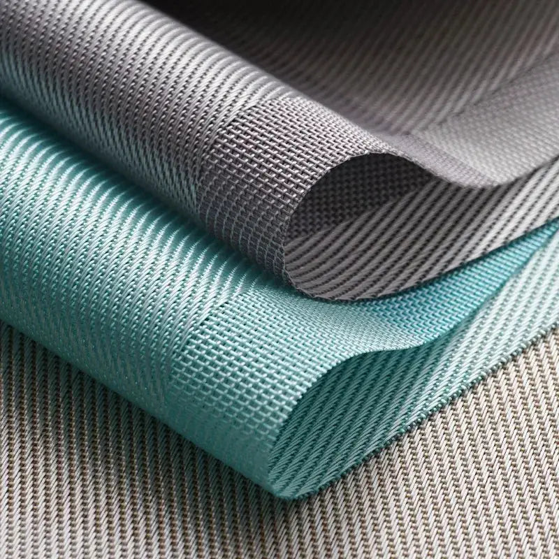 a close up of three different colored fabrics