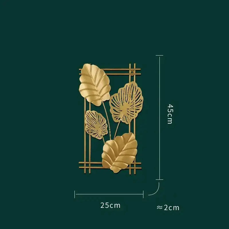 a golden metal wall decoration with leaves on a green background