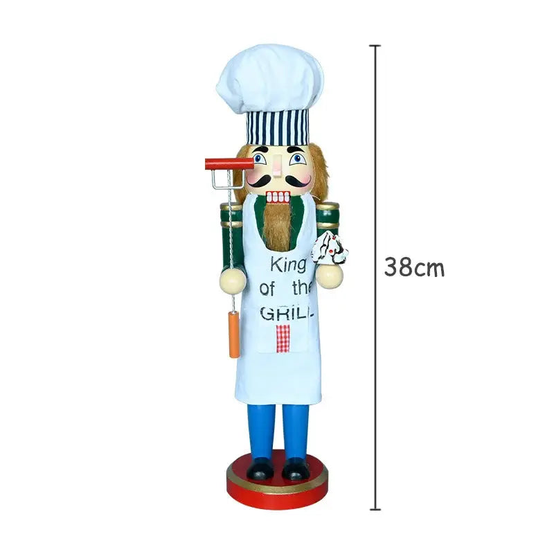 a wooden nutcracker with a chef's hat on it