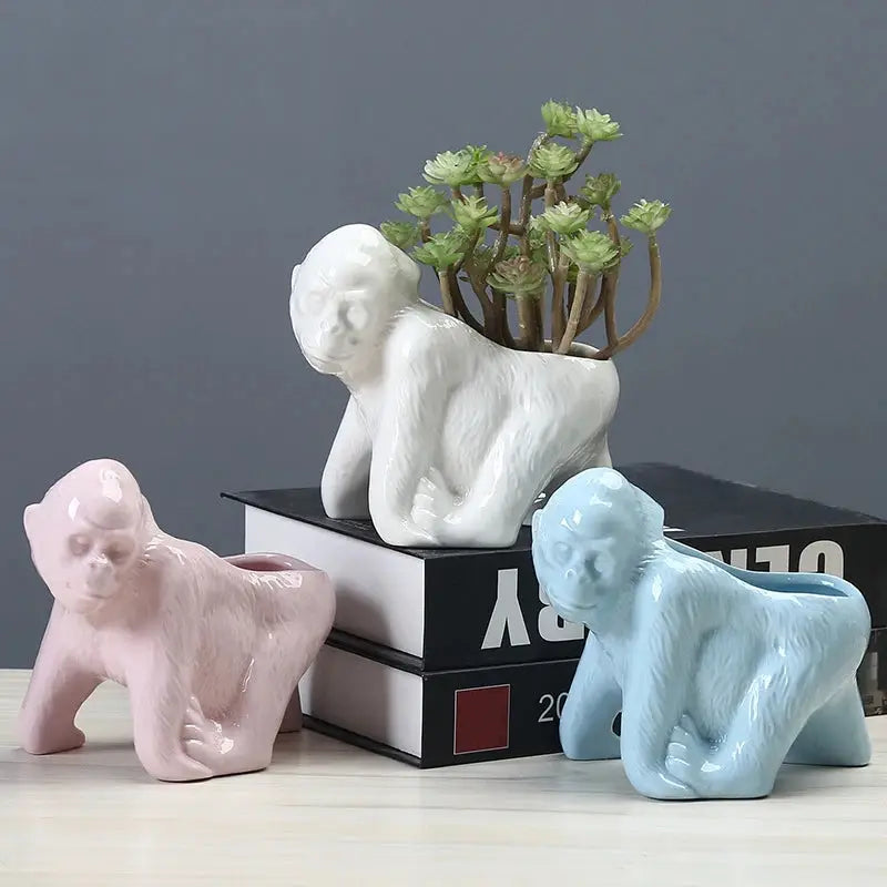 a couple of small figurines sitting on top of a table