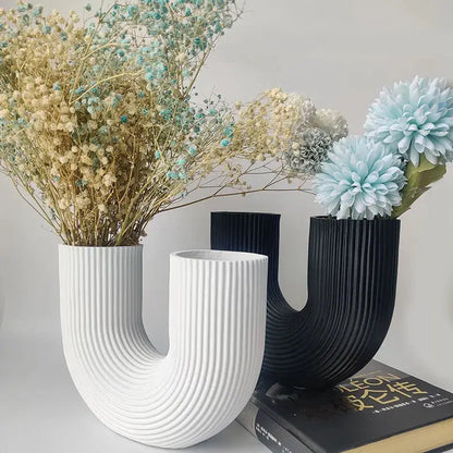 a couple of vases sitting on top of a table