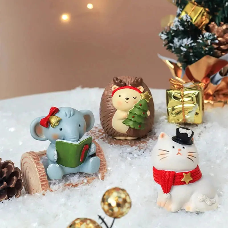 a group of small figurines sitting on top of a pile of snow