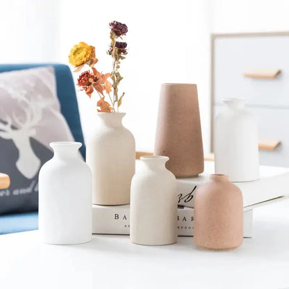 a group of vases sitting on top of a table