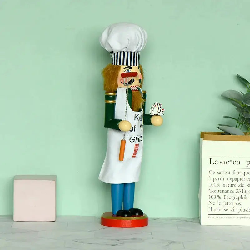 a wooden nutcracker with a chef's hat on