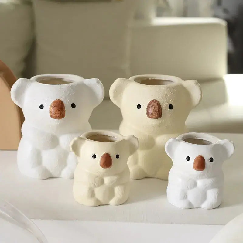 a group of three white teddy bears sitting next to each other