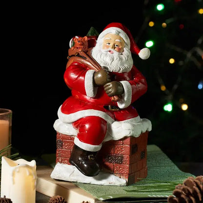 a santa clause figurine sitting on top of a box