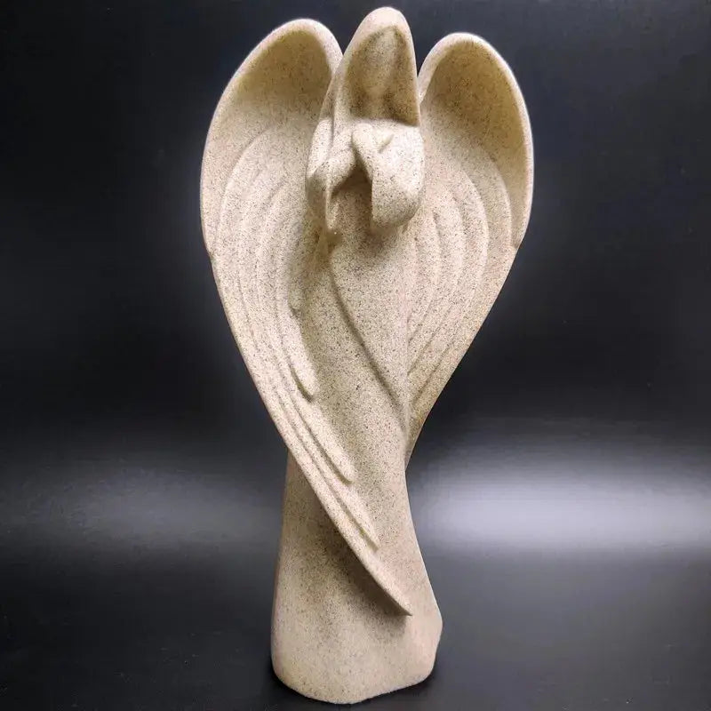 a sculpture of an angel's wings on a black background