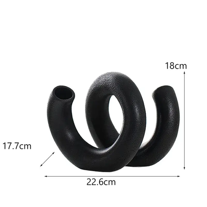 a pair of black rubber cockles on a white background