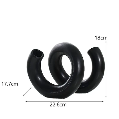 a pair of black rubber cockles on a white background