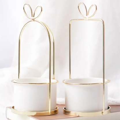 a couple of white dishes sitting on top of a table